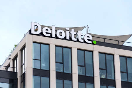 PRAGUE, CZECH REPUBLIC - APRIL 30 2020: Deloitte professional service company network logo on the building of the Czech headquarters on April 30, 2020 in Prague, Czech Republic.のeditorial素材