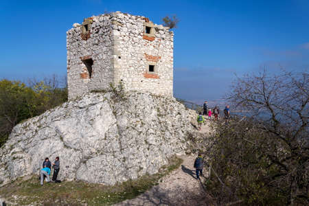 PAVLOV, CZECH REPUBLIC - OCTOBER 12 2019: People at Devicky castle ruins overlooking banks of Nove Mlyny water reservoir in South Moravia on October 12, 2019 in Pavlov, Czech Republic.のeditorial素材