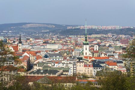 Aerial view of Brno with Church of St. James and Lisen panel housing estate in background, Moravia, Czech Republic, sunny dayの写真素材