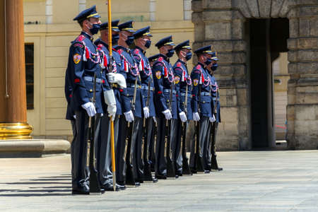 PRAGUE, CZECH REPUBLIC - JUNE 2 2020: Face masks on soldiers in front of the Prague Castle during Changing of the Guard, coronavirus covid-19 pandemic outbreak on June 2, 2020 in Prague, Czech republic.のeditorial素材