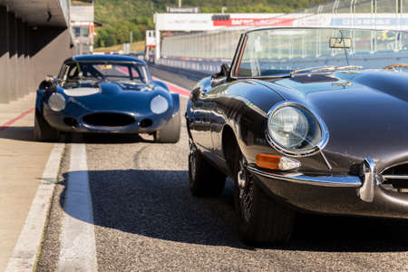 MOST, CZECH REPUBLIC - SEPTEMBER 9 2020: Vintage veteran car Jaguar E-Type competition roadster stands on race track on September 9, 2020 in Most, Czech republic.のeditorial素材