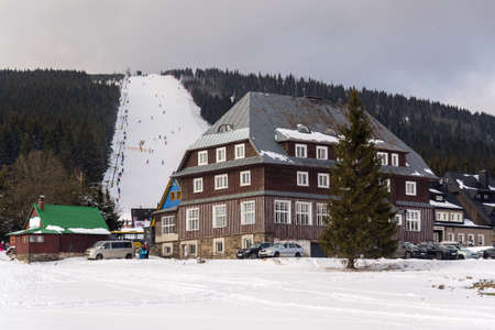 Piste with unrecognizable people skiing, snow, sunny winter day, Horni Mala Upa, Krkonose mountains, Czech Republicのeditorial素材
