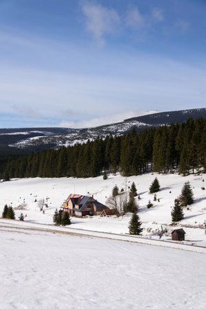 Snezka, the highest mountain in the Czech Republic, Krkonose Mountains, snowy winter day, Polish meteo observatory and Czech post office Postovna seen on topの写真素材