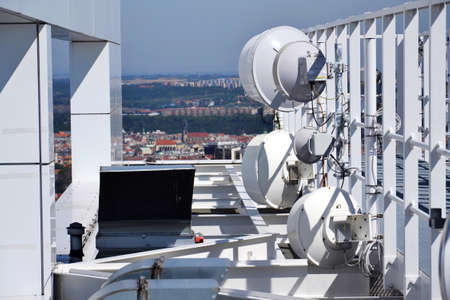 Construction for 5G broadband cellular network transmitters, telecommunication tower, wireless communication concept, clear blue sky background with copy spaceの写真素材