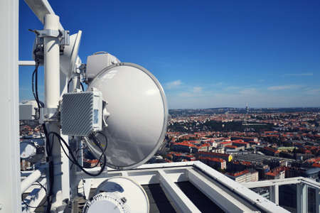 Construction for 5G broadband cellular network transmitters, telecommunication tower, wireless communication concept, clear blue sky background with copy spaceの写真素材