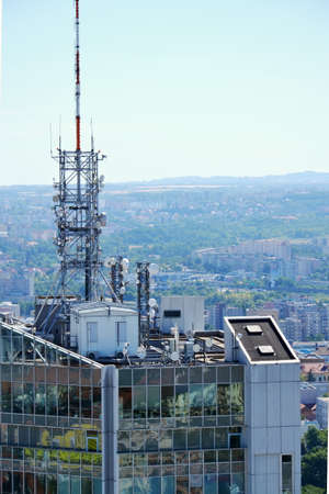 Construction for 5G broadband cellular network transmitters, telecommunication tower, wireless communication concept, clear blue sky background with copy spaceの写真素材
