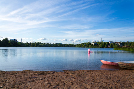 Toolonlahti sea bay with small beach for recreational sports near Olympic stadium and Linnanmaki amusement park, Helsinki, Finlandの写真素材