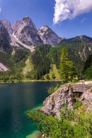Beautiful nature on the shores of the Vorderer Gosausee lake near Gosau, Austria, sunny summer dayの写真素材