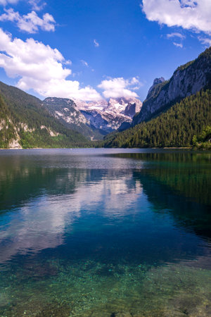 Beautiful nature on the shores of the Vorderer Gosausee lake near Gosau, Austria, sunny summer dayの写真素材