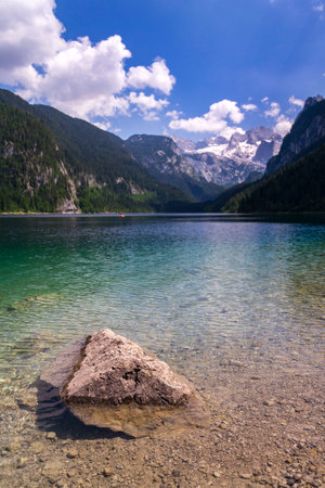 Beautiful nature on the shores of the Vorderer Gosausee lake near Gosau, Austria, sunny summer dayの写真素材