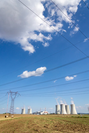 Cooling towers at nuclear power plants, energy self-sufficiency, greenhouse emission reduction and global warming conceptの写真素材