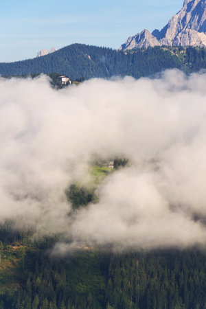 Fog in valley over Schladming, Dachstein Mountains, Northern Limestone Alps, Austriaの写真素材