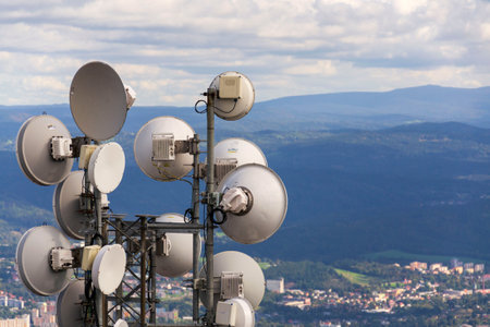 Bunch of transmitters and aerials on telecommunication towerの写真素材