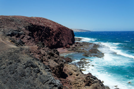 Dramatic cliffs around Montana Bocinegro and Montana Roja mountain, Tenerife coast near El Medano,...