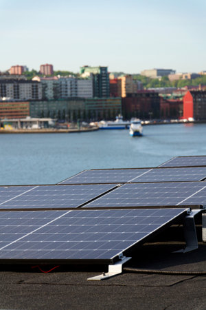 Solar panels on roof of apartment building, renewable green sustainable energy concept, water cooling, aerial view, Gothenburg, Swedenの写真素材