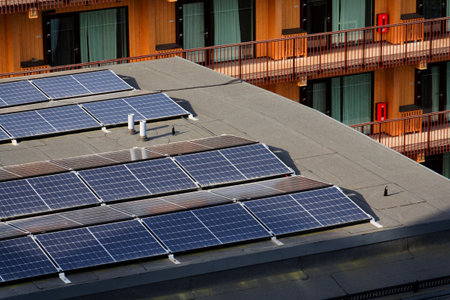 Solar panels on roof of apartment building, renewable green sustainable energy concept, water cooling, aerial view, Gothenburg, Swedenの写真素材