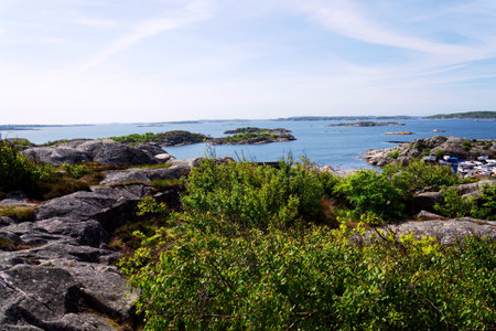 Ships harbor at Saltholmen peninsula on the shore of Alvsborgsfjorden, harbor for archipelago ships, Alvsborg district, sunny day, Gothenburg, Swedenの写真素材