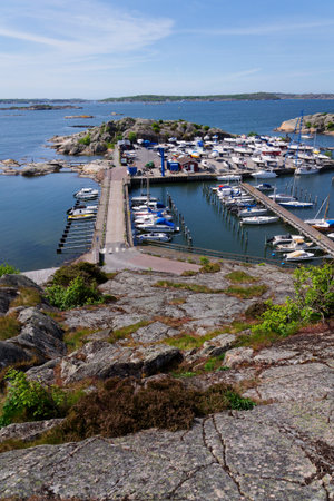 Ships harbor at Saltholmen peninsula on the shore of Alvsborgsfjorden, harbor for archipelago ships, Alvsborg district, sunny day, Gothenburg, Swedenの写真素材