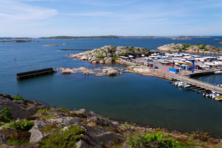 Ships harbor at Saltholmen peninsula on the shore of Alvsborgsfjorden, harbor for archipelago ships, Alvsborg district, sunny day, Gothenburg, Swedenの写真素材