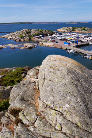 Ships harbor at Saltholmen peninsula on the shore of Alvsborgsfjorden, harbor for archipelago ships, Alvsborg district, sunny day, Gothenburg, Swedenの写真素材