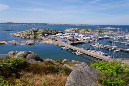 Ships harbor at Saltholmen peninsula on the shore of Alvsborgsfjorden, harbor for archipelago ships, Alvsborg district, sunny day, Gothenburg, Swedenの写真素材