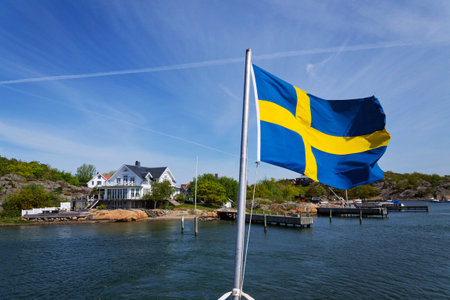 Houses on the rocks of Saltholmen peninsula on shore of Alvsborgsfjorden harbor, Alvsborg district, sunny day, Gothenburg, Swedenの写真素材