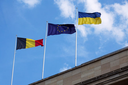 Belgian, EU and Ukrainian flag on the National Bank of Belgium on May 20, 2025 in Brussels, Belgium.の写真素材