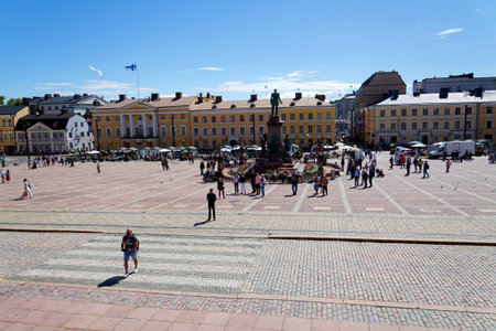 People in front of the Alexander II memorial near the Helsinki cathedral on the Senate square on sunny summer day on July 6, 2024 in Helsinki, Finland.のeditorial素材