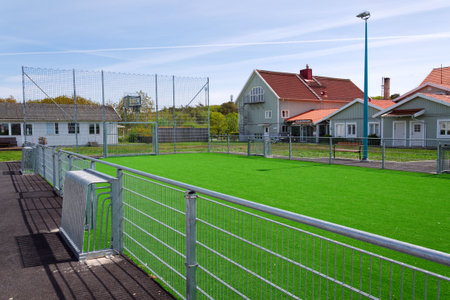 Traditional wooden houses near marina on peaceful car-free Vrango island with seaside village in Gothenburg archipelago, Swedenの写真素材