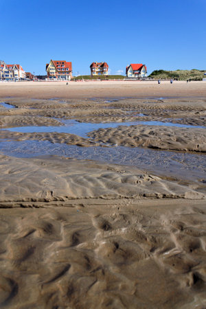 Beautiful seaside beach house on waterfront promenade at the coastal village, West Flanders, sunny summer day, De Haan, Belgiumの写真素材