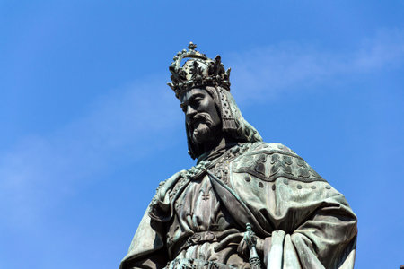Monumental neo-Gothic statue of Emperor Charles IV from 1844 holding a sword and university charters, Krizovnicke square on the foot of the Charles bridge, Prague, Czech republicの写真素材