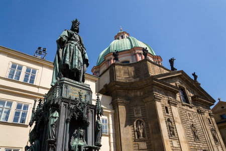Monumental neo-Gothic statue of Emperor Charles IV from 1844 holding a sword and university charters, Krizovnicke square on the foot of the Charles bridge, Prague, Czech republicの写真素材