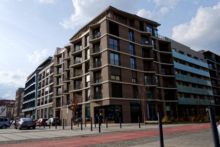 Modern street of the new Smichov City development, contemporary residential buildings, clean urban...
