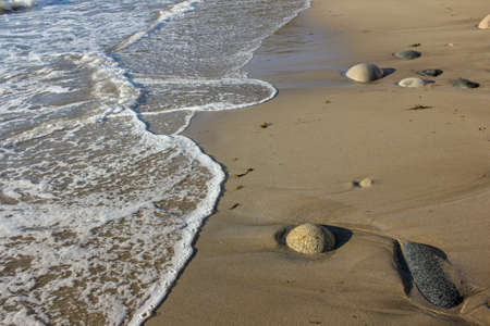 white foam from a wave in a beach of the Cantabrian coast