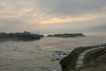 enjoying a cloudy sunset in the last days of our holidaysの写真素材