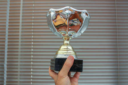 holding in my hand the winner cup makes me remember I am powerful even in my worse daysの写真素材