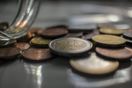 some coins spread out on the table to pay for transport