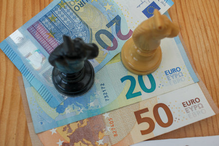 chess pieces on euro notes. Think about where to invest in times of inflationの写真素材