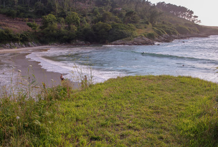 tiny beach in the Atlantic ocean in Spain during sunsetの写真素材