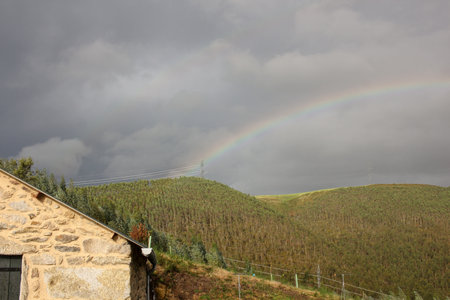 rainbow in the mountains in an autumn dayの写真素材