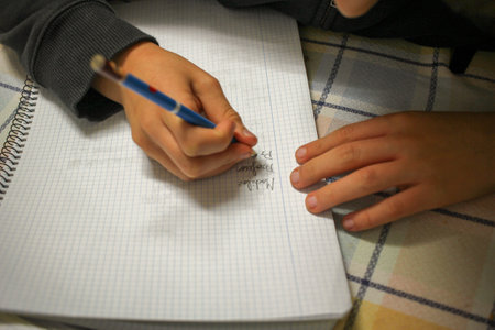 Student Success: Kid Writing and Studyingの写真素材