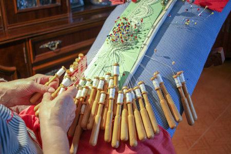 Timeless Craft: Octogenarian Creating Bobbin Lace at Homeの写真素材