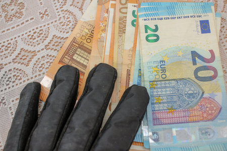 Currency Connection: Gloved Hand and Euro Banknotes