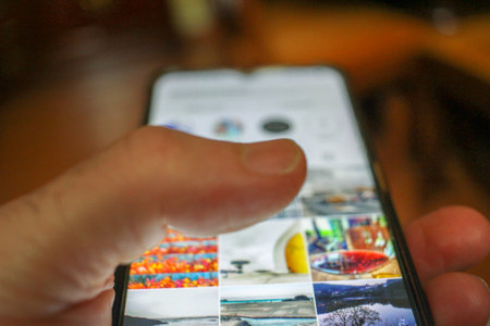 Digital Connection: A Man's Touch on the Mobile Screenの写真素材