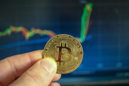 bitcoin value is rising very sharply. I hold a bitcoin between my fingers