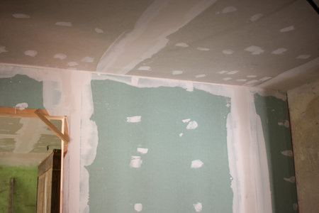 walls and ceiling in an old house are ready to be painted whiteの写真素材