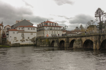 some buildings near the river and roman bridge in Chaves, Portugal
