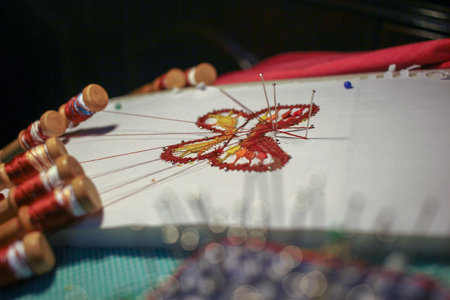 beautiful butterfly made with bobbin lace by a senior woman