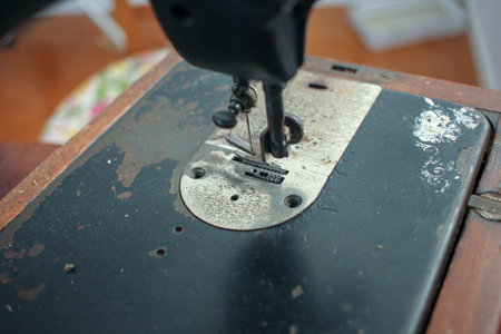 an old sewing machine is working well at home