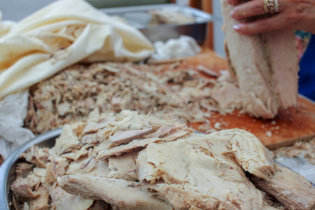 the process of cleaning bonito before preserving it in olive oilの写真素材